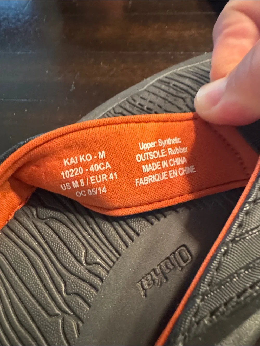 OluKai Men's Black Flip-Flops with Orange Accents